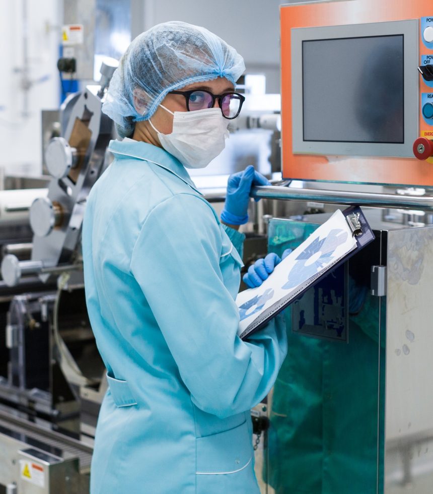 factory worker work with control panel