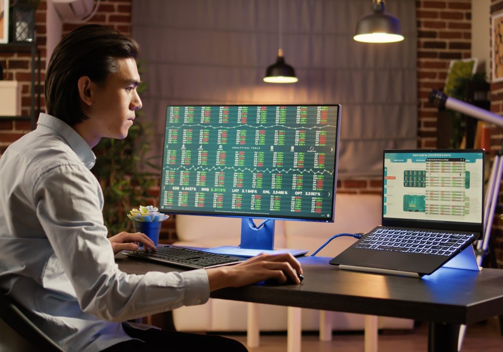 Financial analyst looking at real time trade exchange statistics
